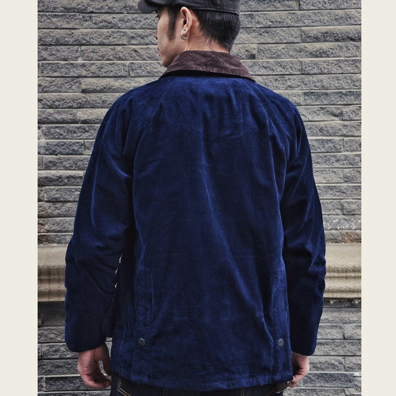 Rear worn view of the navy corduroy hunting jacket, showing its shape and length.