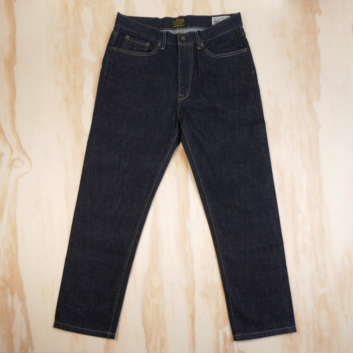 Front view of OKONKWO 13.2 oz dark indigo selvedge straight jeans